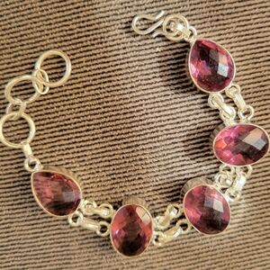 Elegant Gold Bracelet with Purple Gemstones